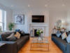 80 Rodney Street - Living Area with Fireplace and TV